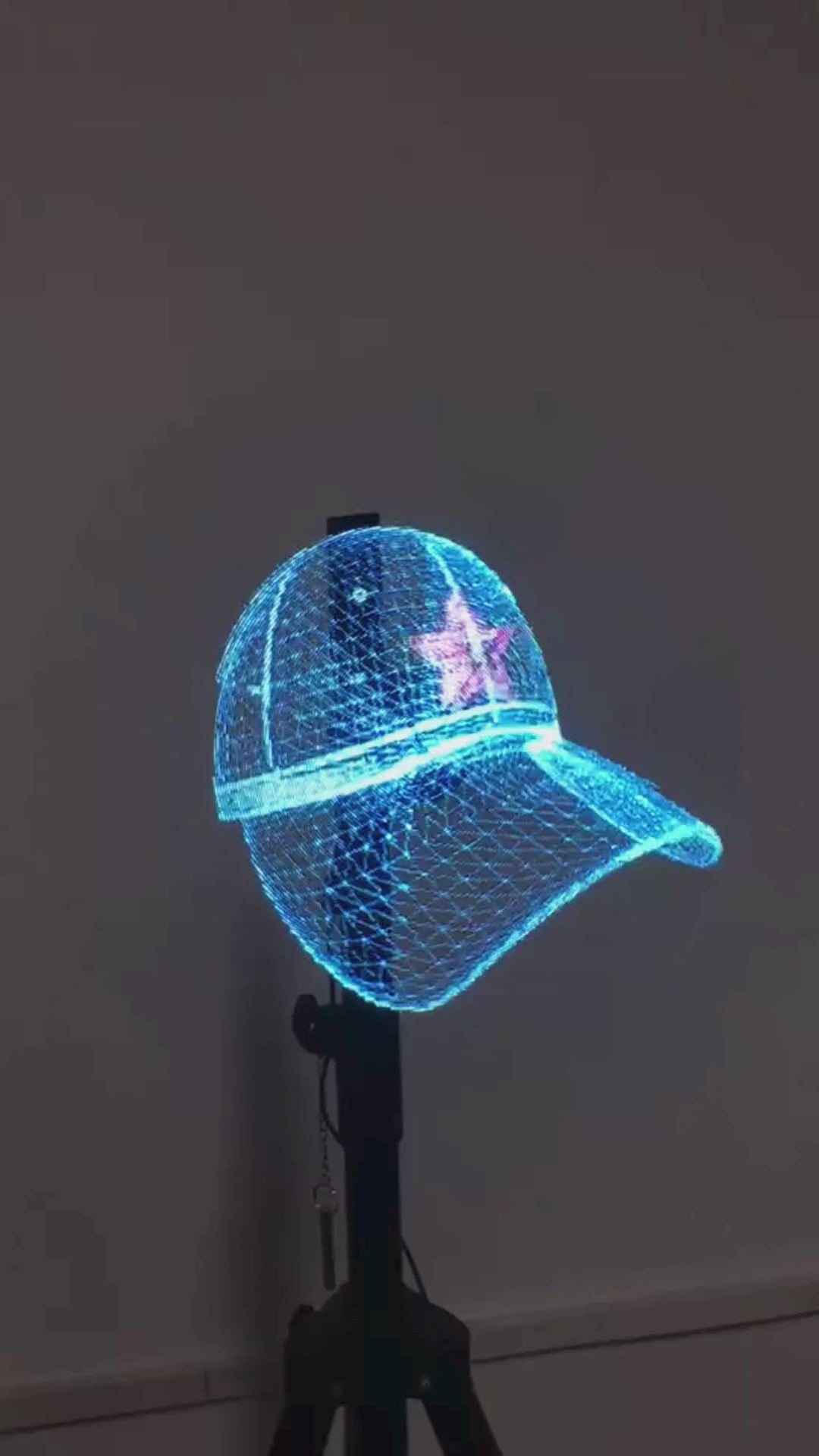 Video of a cap being projected on a hologram projector